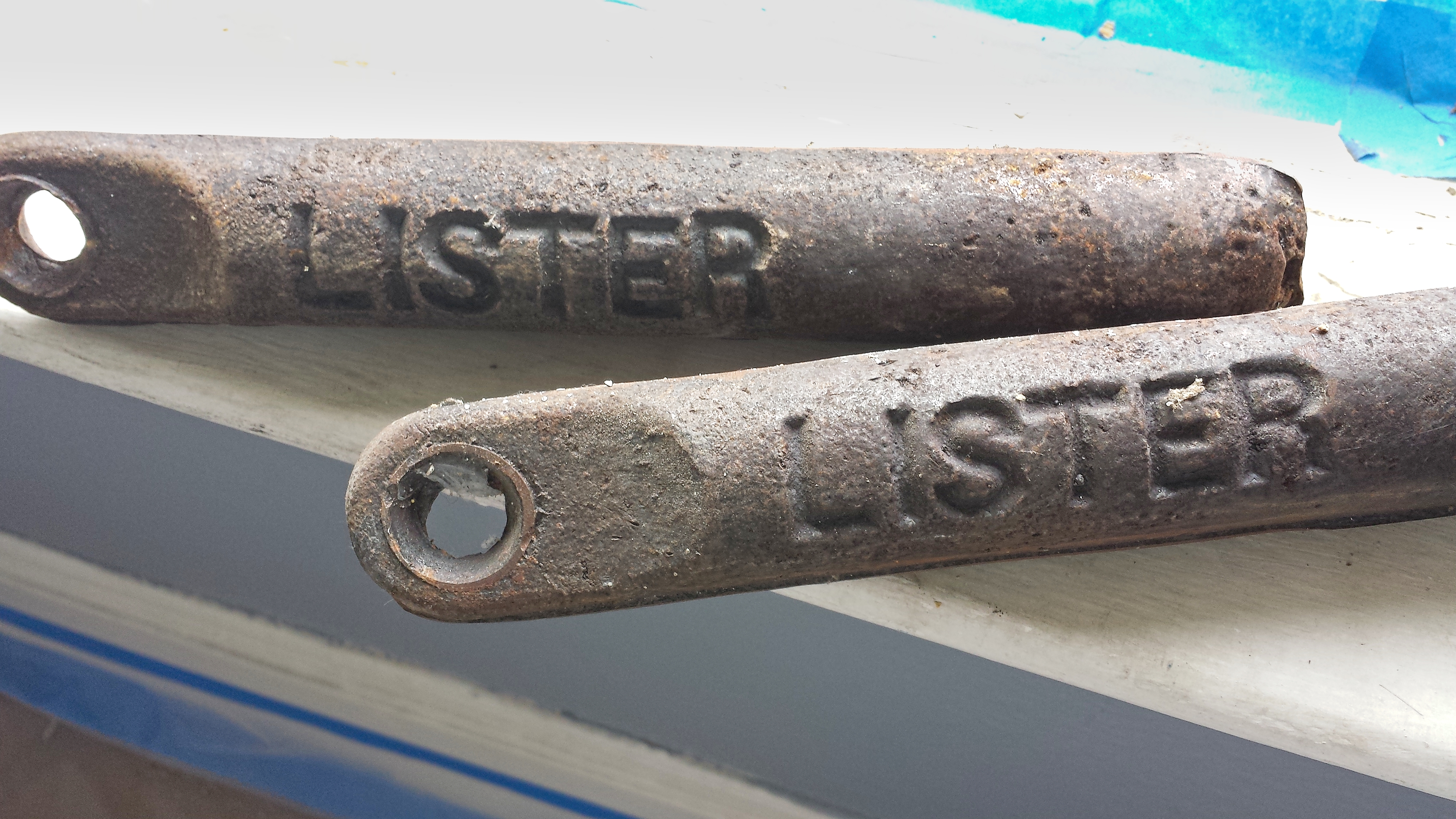 Old weights were made of cast iron. Lister is presumed to be the craftsperson who made these weights.